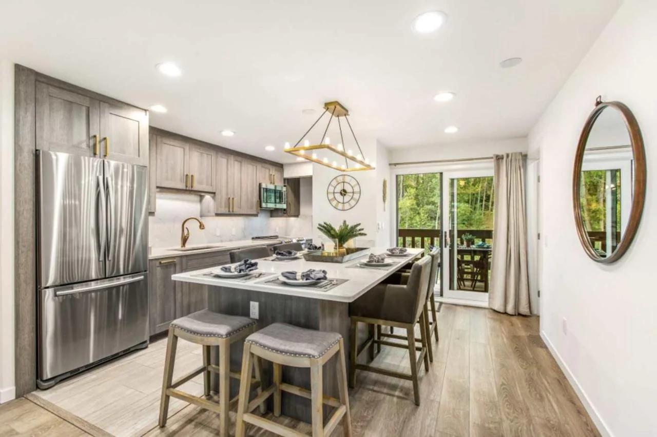Designer 2 BR on River with Pool - Walk to Town! photo