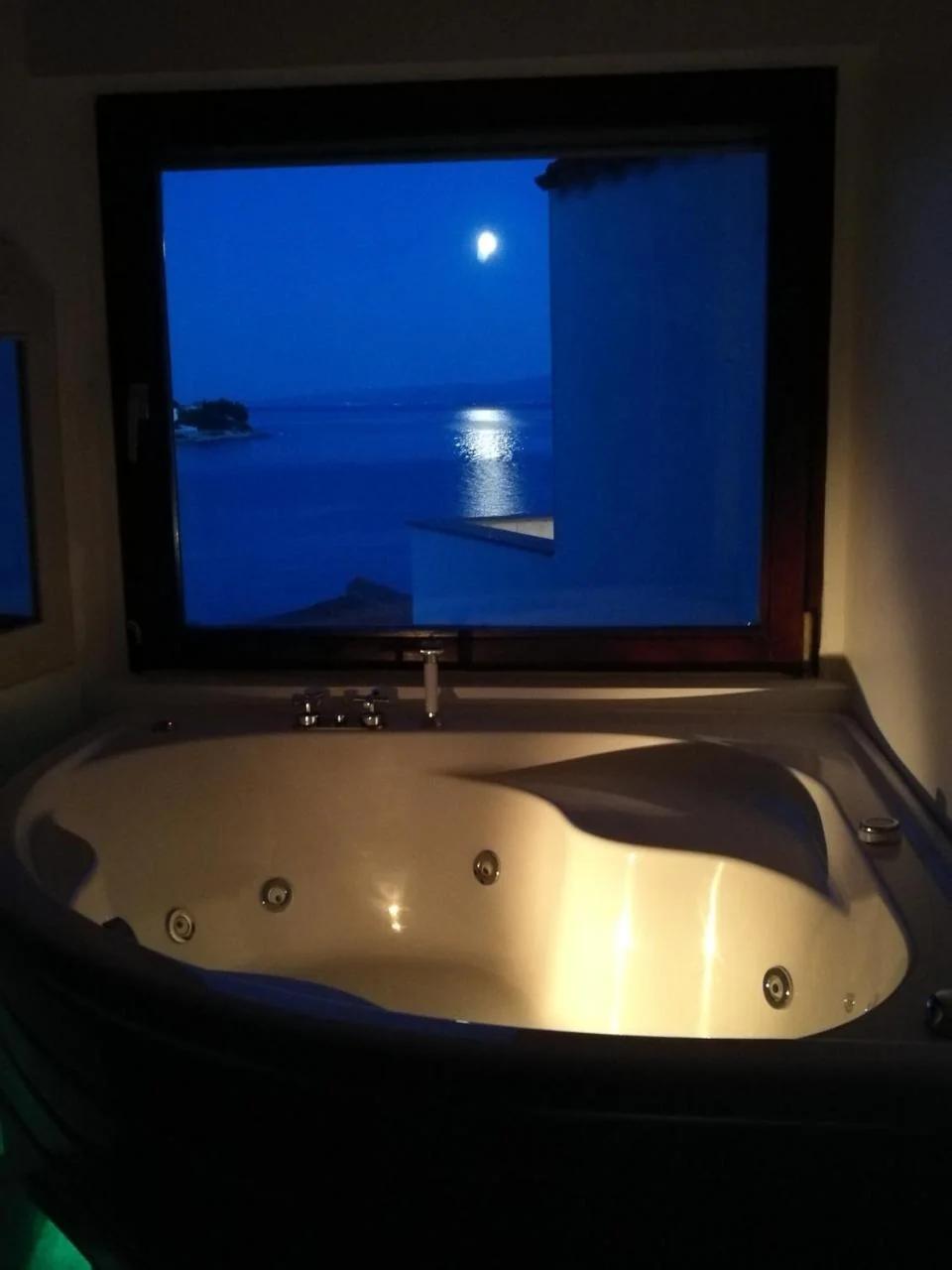 Beach house BellaVista with hot pool photo