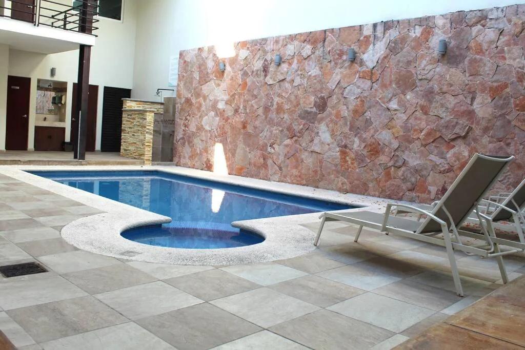Departamento a 200 Mts de la playa y alberca en planta baja photo