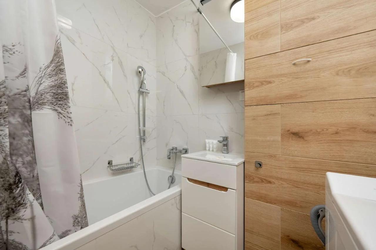 Blue Two Bedroom Apartment in Wrocław with Desk, Bathtub and Balcony by Noclegi Renters photo