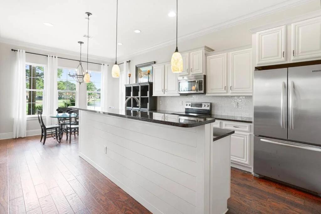 4 Bedroom house on the golf course with 2 golf carts! photo